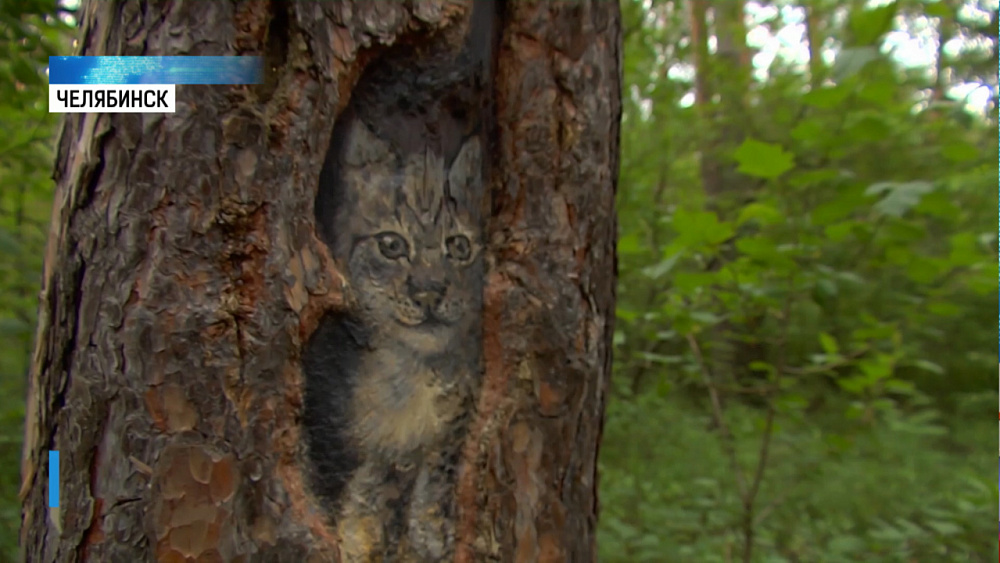 Художница разрисовала деревья в парке Гагарина