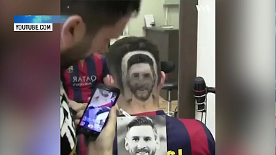 Сербский цирюльник делает портреты на затылках